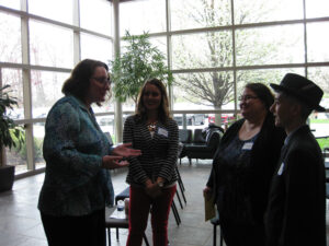 Ellen Fedon-Keyt, Ph.D., talks with attendees.