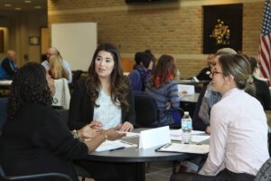 PsyD 1 students talking with potential practicum sites.