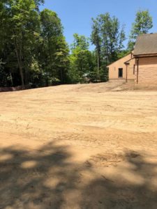 Image of clear flat dirt ready for parking lot.