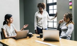 Women meeting and talking in generic looking room