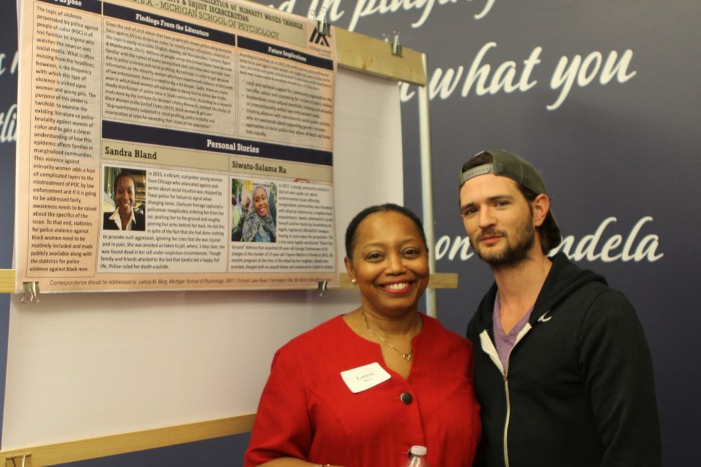 Students posing with research poster