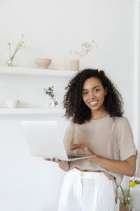 stock photo of a women holding a laptop