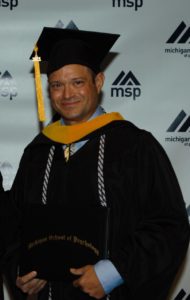 Photo of George Chapp in cap and gown