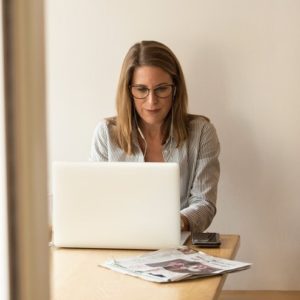 Woman with long hair sitting at computer