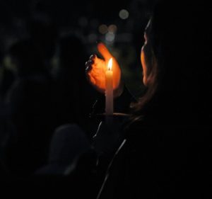 Stock Photo of Individual hold candle at a vigill