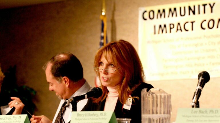 Donna Rockwell speaking into a microphone