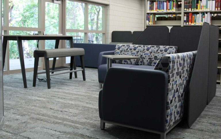 Photo of new library furniture featuring L shaped couches.