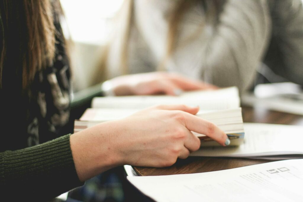 Stock phone of a woman's hand holding a book