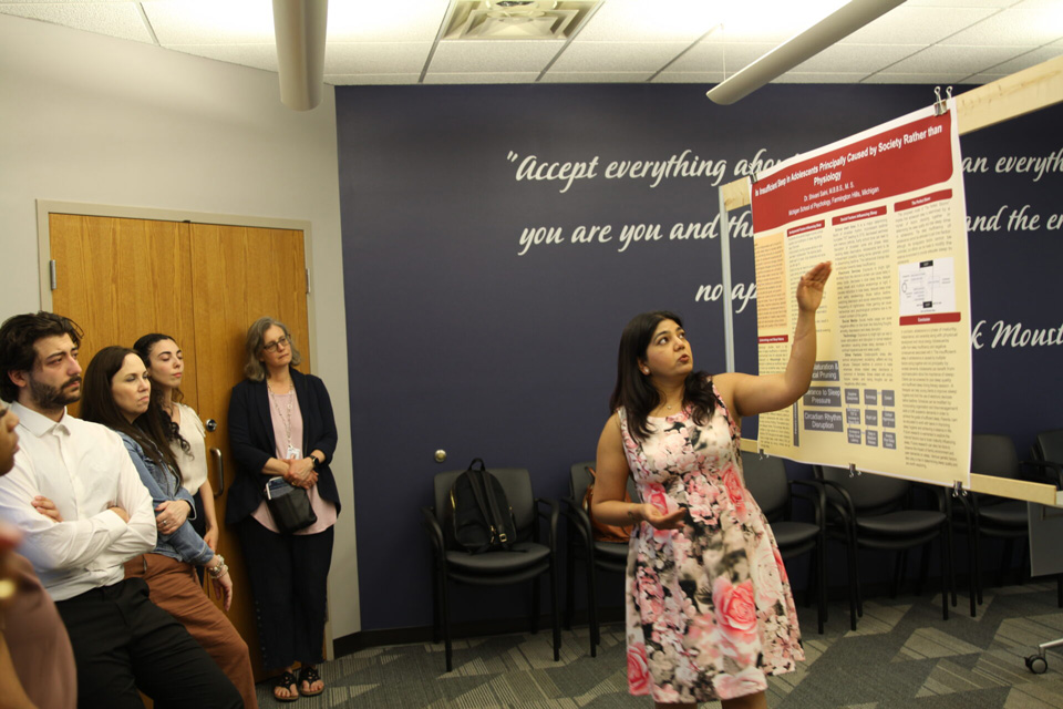 Shivani Sani presenting her research poster.
