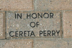 Photo of a brick paver that engraved with the message, "In honor of Cereta Perry" 