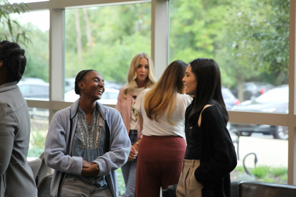 Students laughing in the atrium