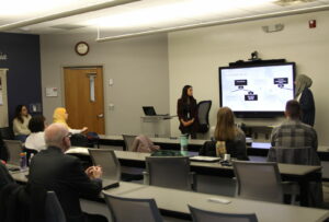MA Student's Deena Hadad and Raghad Hamami giving a presentation.