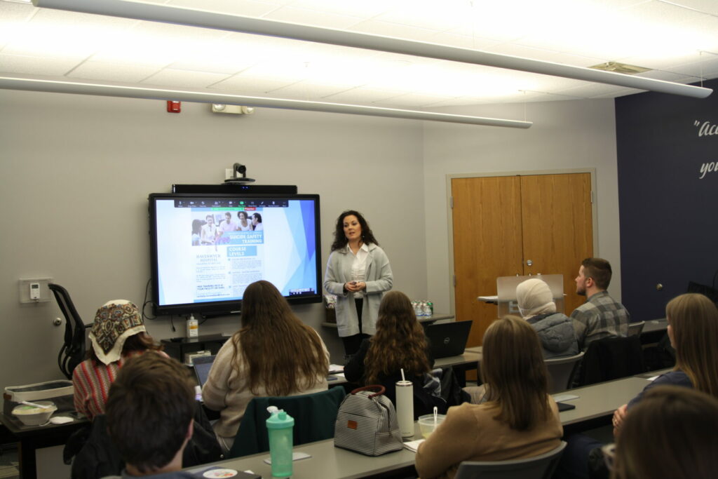Michelle Ciaramellano presenting to a classroom.
