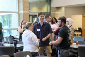 Three students participating in the icebreaker