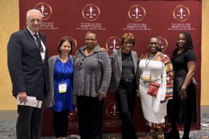 Dr. Brian Stogner (MSP President), Dr. Carrie Pyeatt (Staff), Carol Hanson (Staff), Dr. Tonya Martin (Board Chair), Jennifer Thomas-Spoekan (MA With ABA), and Kierra Poydras (MA '25, PsyD 1) at the symposium.